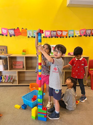 Children engaging in joyful classroom play